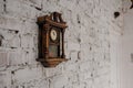 Old Vintage wood clock on the brick wall Royalty Free Stock Photo