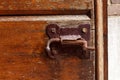 Old vintage wood door lock lock rusty brown brick wall forged wooden gate valve latch bolt catch