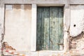 Old vintage wood door with old green window Royalty Free Stock Photo