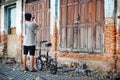 Old vintage wood door wood texture Old brick wall Bicycle tourists Bicycle touring attractions Old house over 230 years old.bangk