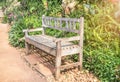 Old vintage wooden bench in the garden public park Royalty Free Stock Photo