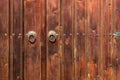 Old vintage wooden door ornate with a beauty metal furniture.