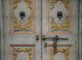 Old vintage wooden door & retro metal handle knocker doorkhob Royalty Free Stock Photo