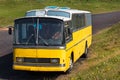 Old vintage yellow bus parked outdoors in Vestmannaeyjar, Iceland