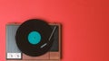 Old vinyl player and turnable on a red background Royalty Free Stock Photo