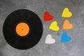 old vinyl record and colorful heart shapes. Top view, copy space. Valentines day concept. Royalty Free Stock Photo