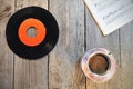 Old vinyl record, cup of coffee and music notes Royalty Free Stock Photo