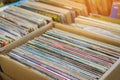 Old vinyl records for record player are in paper box. Antiques. Background Royalty Free Stock Photo