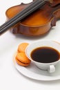 Old violin, cup of coffee and traditional french colorful macarons Royalty Free Stock Photo