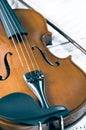 Old violin lying on the sheet of music, music concept Royalty Free Stock Photo