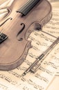 Old violin lying on the sheet of music, music concept Royalty Free Stock Photo