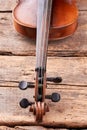 Old violin part on wooden planks close up. Royalty Free Stock Photo