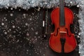 Old violin and silver color Christmas decor. Christmas, New Year`s concept. Top view, close-up Royalty Free Stock Photo