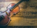 Old violin on a wooden background Royalty Free Stock Photo