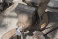 Old vise and hammer on the desktop in the workshop Royalty Free Stock Photo