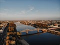 A city with houses, a river and bridges at sunset. the view from the top Royalty Free Stock Photo