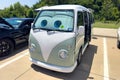 An old Volkswagen camper van parked in car park.