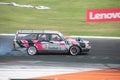 Old Volvo 240 station wagon tuned up with a twin-turbo engine drifting on the racing circuit