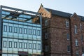 Old vs New Architecture Comparison Glass Building and Brick Side Royalty Free Stock Photo