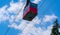 Old waggon moves along cable car in sunny weather. Royalty Free Stock Photo