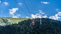 Old waggon moves along cable car in sunny weather. Royalty Free Stock Photo