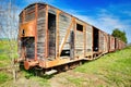 old wagon, train wagon at an old station on the rails Royalty Free Stock Photo