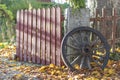 An old wagon wheel in fall