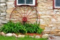 Old Wagon Wheel in Front of Stone Barn