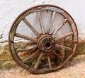 Old wagon wheel made of wood and iron. Royalty Free Stock Photo