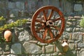 old wagon wheel at a stonewall Royalty Free Stock Photo