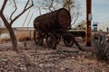 Old wagon with a wooden barrel on it, standing in the yard Royalty Free Stock Photo