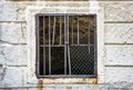 Old wall with barred window Royalty Free Stock Photo