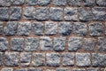 Old wall of blue gray square stone bricks with red cement. rough surface texture Royalty Free Stock Photo