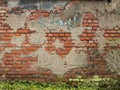 Old Wall with Broken Plaster and Bricks Royalty Free Stock Photo