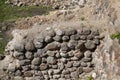 The old wall of the building is made of stones and cobblestones Royalty Free Stock Photo