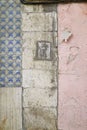 Old wall with ceramic tiles, dirty blocks and peeling paint Royalty Free Stock Photo