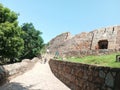 The old wall of the famous Tughlaqabad fort and its entry gate of Delhi, the capital of India Royalty Free Stock Photo