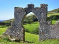 Old wall gate overlooking pasture with cows in Ireland Royalty Free Stock Photo