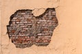 Old wall of a house with collapsed plaster Royalty Free Stock Photo