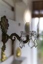 Old Wall lamp made of Brass with a blown glass Plate and Drops Royalty Free Stock Photo