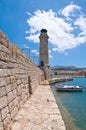 The old wall with the lighthouse. Rethymno city, The Crete island,Greece. Royalty Free Stock Photo