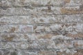Old wall made of big stones and broken bricks Royalty Free Stock Photo