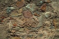 Old wall made of rough stones forming a singular background at Caceres