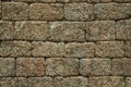 Old wall made of stone bricks forming a charming background