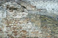 The old wall, mixed various bricks. Fragment of the historical building Royalty Free Stock Photo