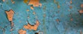 Old wall with orange and blue paint peeling off. background or texture Royalty Free Stock Photo