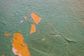 Old wall with orange and blue paint peeling off. background or texture Royalty Free Stock Photo
