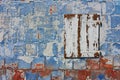 Old wall with peeling paint and closed white window Royalty Free Stock Photo