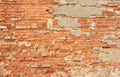 Old Wall of Red Bricks and White Brayed and Cracked Old Paint. Red, Terracotta and White Brick Background. Old Wall for Background Royalty Free Stock Photo