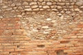 Old Wall of Red Bricks and White Brayed and Cracked Old Paint. Red, Terracotta and White Brick Background. Old Wall for Background Royalty Free Stock Photo